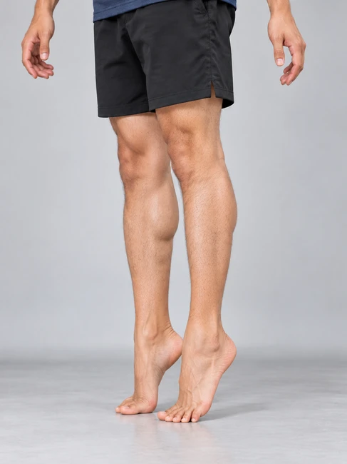Floor-level heel raise exercise for retrocalcaneal bursitis - toe raise and controlled lowering position